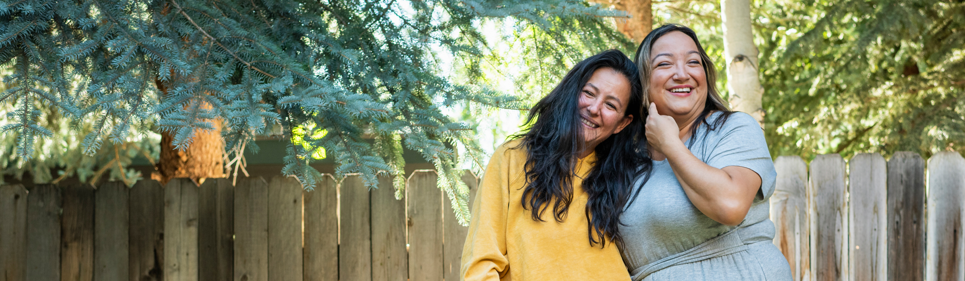 Two women outside smiling